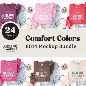 May include: A product mockup featuring several long-sleeved t-shirts in various colors, including pink, red, and brown, with the text "GOLDIE MOCKS" printed on the front. The image also includes the text "Comfort Colors 6014 Mockup Bundle" and "24 Colors".