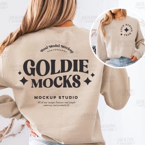 May include: A beige sweatshirt with the text "GOLDIE MOCKS" in black. The sweatshirt also has the text "Real Model Mockup Photography" and "MOCKUP STUDIO" in black. The text "All of our images feature real people wearing real products" is also included in black.