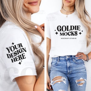 May include: A white t-shirt mockup with the text "Goldie Mocks Mockup Studio" on the front. The model is wearing the shirt with distressed denim jeans.