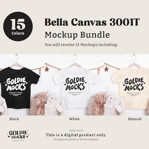 May include: A mockup bundle featuring Bella Canvas 3001T t-shirts in black, white, and natural colors. Each shirt displays the "GOLDIE MOCKS" logo. The image includes the text "15 Colors" and "Mockup Bundle". The product is a digital download.