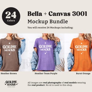 Puede incluir: Tres mujeres vistiendo camisetas de diferentes colores con el texto "GOLDIE MOCKS" impreso en la parte delantera. Las camisetas son marr&oacute;n jaspeado, morado jaspeado y naranja quemado. Las mujeres llevan chaquetas vaqueras y est&aacute;n de pie frente a un fondo blanco.