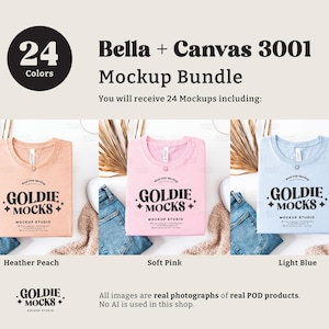 May include: Three Bella + Canvas 3001 t-shirts in different colors: heather peach, soft pink, and light blue. Each shirt has a folded design with the text "Goldie Mocks" and "Mockup Studio" printed on the front.