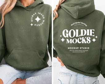 May include: A green hoodie with a white logo that says "Goldie Mocks" and "Mockup Studio". The logo also includes a small star design. The hoodie is being modeled by a person wearing blue jeans.