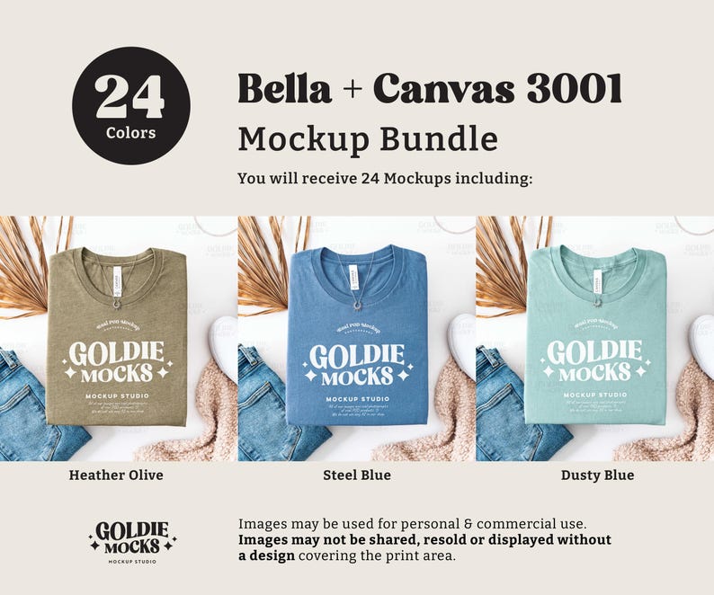 May include: Three folded t-shirts in different colors: heather olive, steel blue, and dusty blue. Each shirt has a white graphic print that says "Goldie Mocks Mockup Studio".