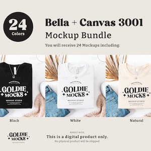 May include: Mockup bundle of 24 Bella + Canvas 3001 t-shirts in black, white, and natural colors. The shirts are laid flat on a white surface with a neutral background. The text "GOLDIE MOCKS MOCKUP STUDIO" is printed on each shirt.