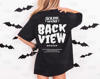May include: Black t-shirt with a white "BACK VIEW" graphic. The shirt is part of a mockup, with bat decorations on a white background. The shirt has a relaxed fit and short sleeves, suitable for casual wear.