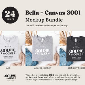 May include: Mockup bundle of 24 Bella + Canvas 3001 t-shirts in various colors. The image shows three t-shirts in the colors Ash, Athletic Heather, and Dark Grey Heather. Each t-shirt has the text "Goldie Mocks" printed on the front.