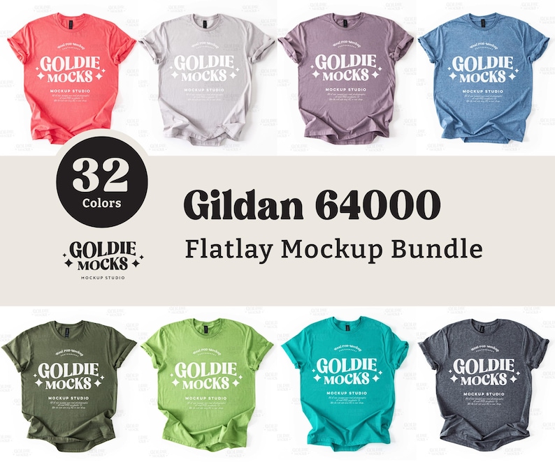 Op de afbeelding: Een flatlay mockup-bundel met 32 Gildan 64000 T-shirts in verschillende kleuren. De T-shirts liggen op een wit oppervlak en hebben de tekst "Goldie + Mocks" op de voorkant.