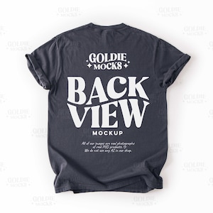 May include: A dark blue t-shirt with a white graphic that says "GOLDIE MOCKS BACK VIEW MOCKUP".