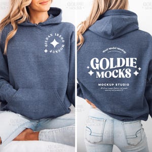 May include: A blue hooded sweatshirt with a white logo on the front and back. The logo on the front says "GILDAN 18500 MOCKUP" and the logo on the back says "GOLDIE MOCKS MOCKUP STUDIO".
