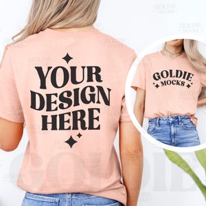 May include: A peach colored t-shirt mockup with the text "YOUR DESIGN HERE" in black. The shirt is shown on a model from the back and front. The front of the shirt has the text "GOLDIE MOCKS" in black.
