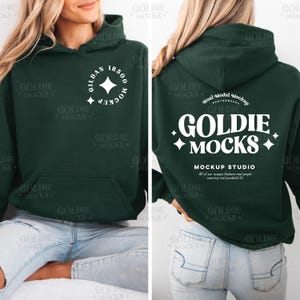 May include: A dark green hoodie with a white logo on the front that says "GILDAN 18500 MOCKUP" and a white logo on the back that says "GOLDIE MOCKS MOCKUP STUDIO All of our images feature real people wearing real products".