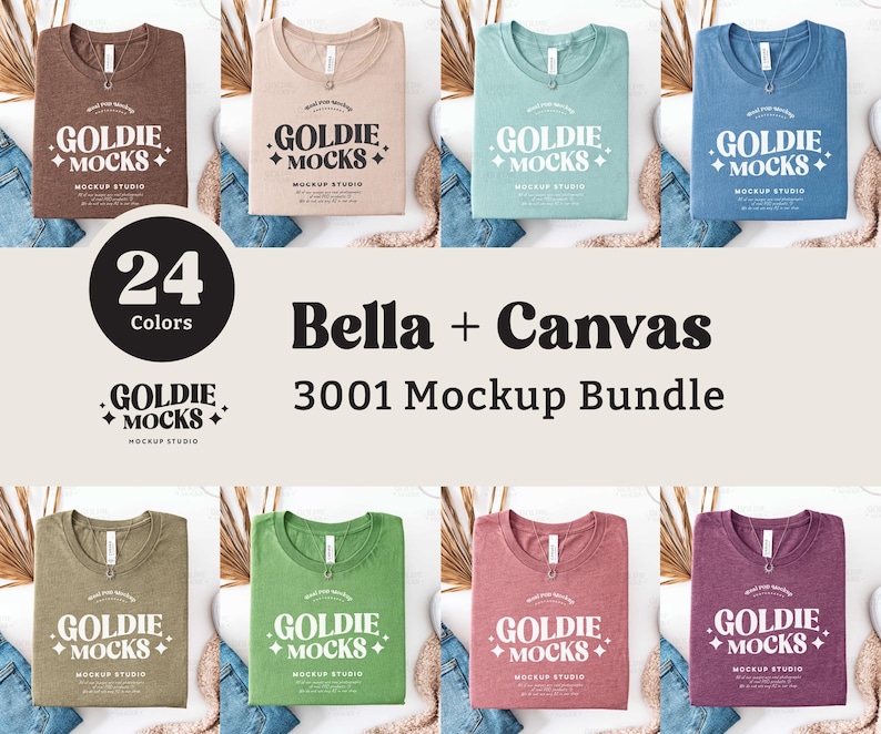 May include: A mockup bundle of 24 Bella + Canvas 3001 t-shirts in various colors. The shirts are laid flat on a white surface with a light brown, light green, light blue, and light pink shirt in the front row. The text "GOLDIE + MOCKS + MOCKUP STUDIO" is printed on each shirt.