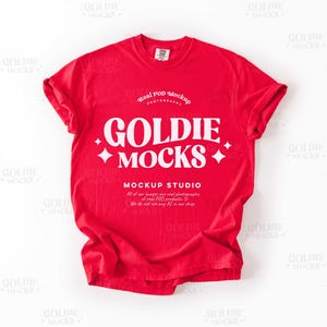 May include: Red t-shirt mockup with white text that reads "Real POD Mockup", "Goldie", "Mocks", and "Mockup Studio".