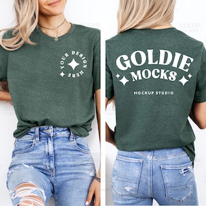 May include: A dark green t-shirt with a white design on the front that says "Your Design Here" with a star in a circle. The back of the shirt has a white design that says "Goldie Mocks Mockup Studio".