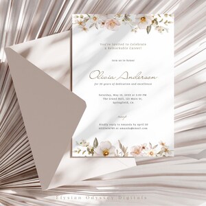 May include: A white invitation with a floral border and gold text. The invitation is for a celebration of Olivia Anderson's 30 years of dedication and excellence. The event will be held on Saturday, May 10, 2023 at 3:00 PM at The Grand Hall, 123 Main St, Springfield, CA. RSVP to Amanda by April 20 at amanda@email.com.