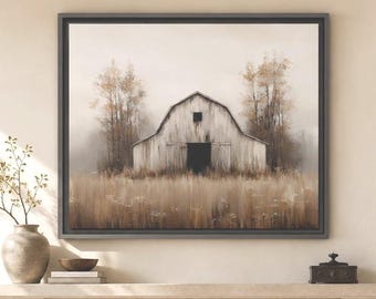 May include: A framed wall art print depicting a weathered white barn situated in a field of tall, dry grass under a muted sky, flanked by sparse trees. The artwork features a dark frame and is displayed above a stone fireplace mantel.