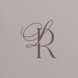 May include: A brown monogram design featuring the letters 'S' and 'R' intertwined in an elegant, cursive script. The letters are set against a neutral, textured background, creating a sophisticated and classic aesthetic.