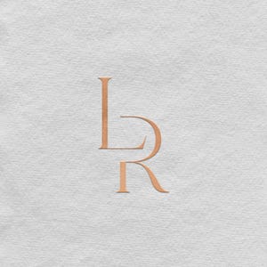 May include: A minimalist design featuring the intertwined letters "L" and "R" in a warm, copper-toned colour. The letters are embossed on a textured, off-white background, creating a subtle, elegant aesthetic. The design is simple yet sophisticated.