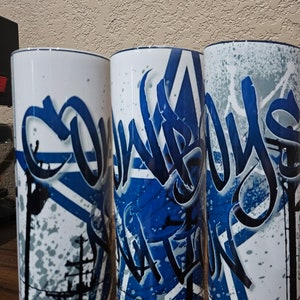 Dallas Cowboys 20 ounce Stainless Steel tumbler with a lid and straw