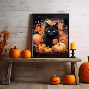Puede incluir: Un gato negro con ojos verdes se sienta en una pintura rodeado de calabazas naranjas y hojas de oto&ntilde;o. La pintura est&aacute; enmarcada en negro y tiene el texto "Drawn with Love" en la esquina superior derecha.