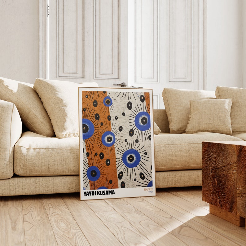 May include: A poster featuring a colorful abstract design with blue, orange, and black circles. The poster is titled "Yayoi Kusama" and has the text "無限の網" in Japanese.