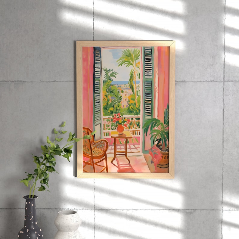 May include: A painting of a room with a window overlooking a cityscape. The window is open and there is a chair and a small table with a vase of flowers in the room. The painting is framed in a light wood frame.
