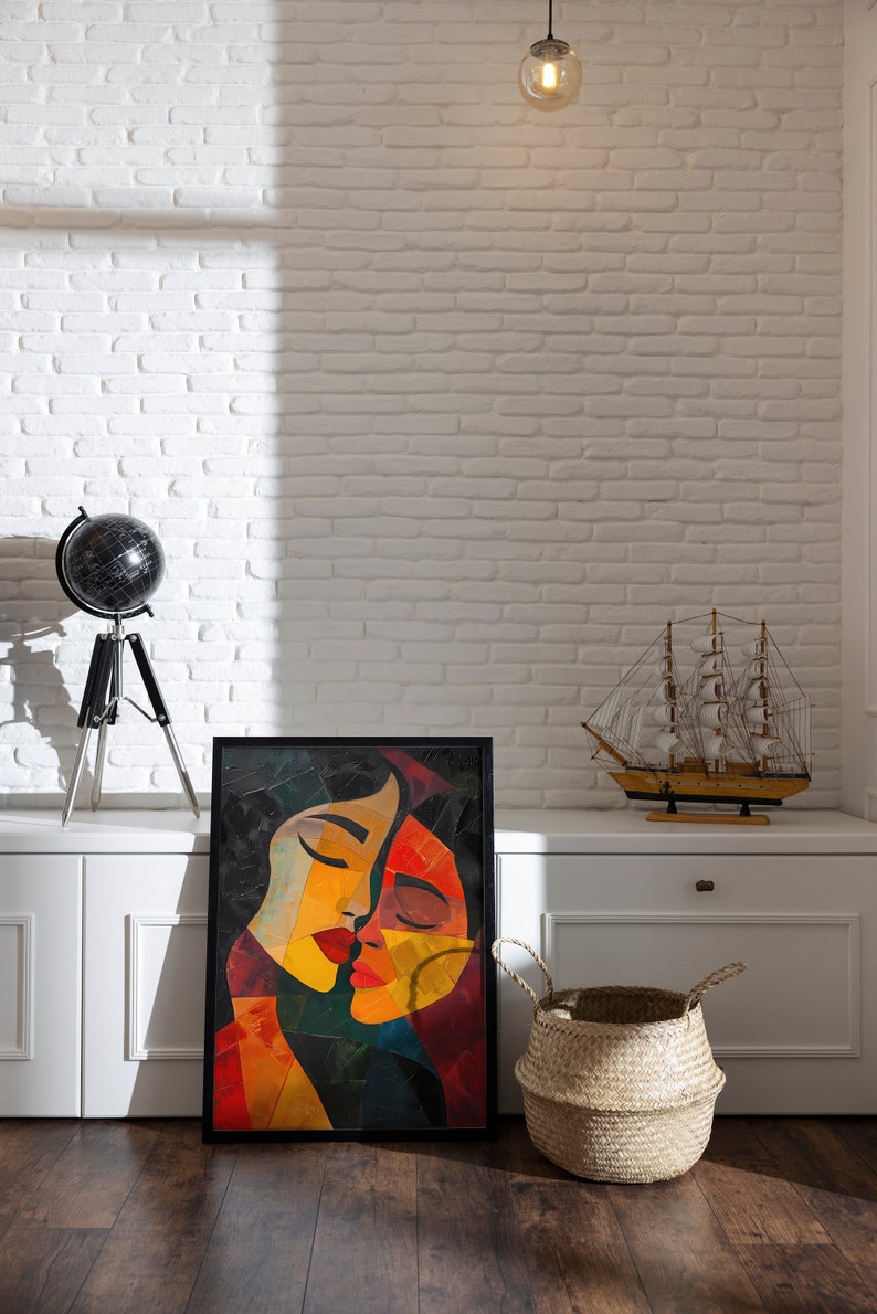 May include: A framed abstract painting of two faces in shades of red, yellow, and blue against a white brick wall. A globe on a tripod stand and a model sailing ship are on a white shelf below the painting.