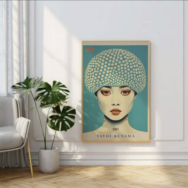 May include: A framed art print depicting a woman with a polka-dot hat and orange makeup. The artwork is signed "YAYOI KUSAMA" and includes Japanese text. The background is teal. The print is in a gold frame.