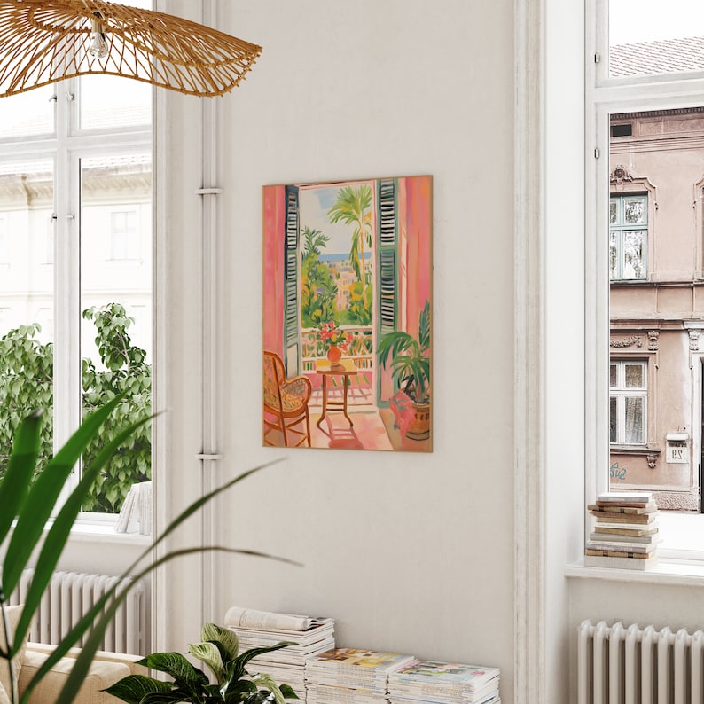 May include: A painting of a pink room with a window looking out onto a cityscape. The window is open and there is a chair and a small table in the room. The cityscape is painted in a bright, colorful style.