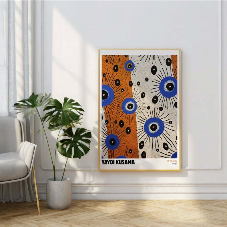 May include: A framed print of an abstract art piece featuring a white background with blue and orange circles and dots. The print is titled "Yayoi Kusama, Tokyo".
