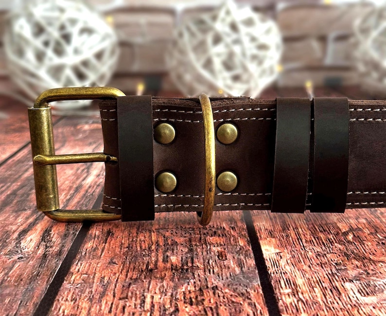 Handcrafted dark brown leather dog collar featuring double stitching, antique brass hardware, and a durable three-layer construction.