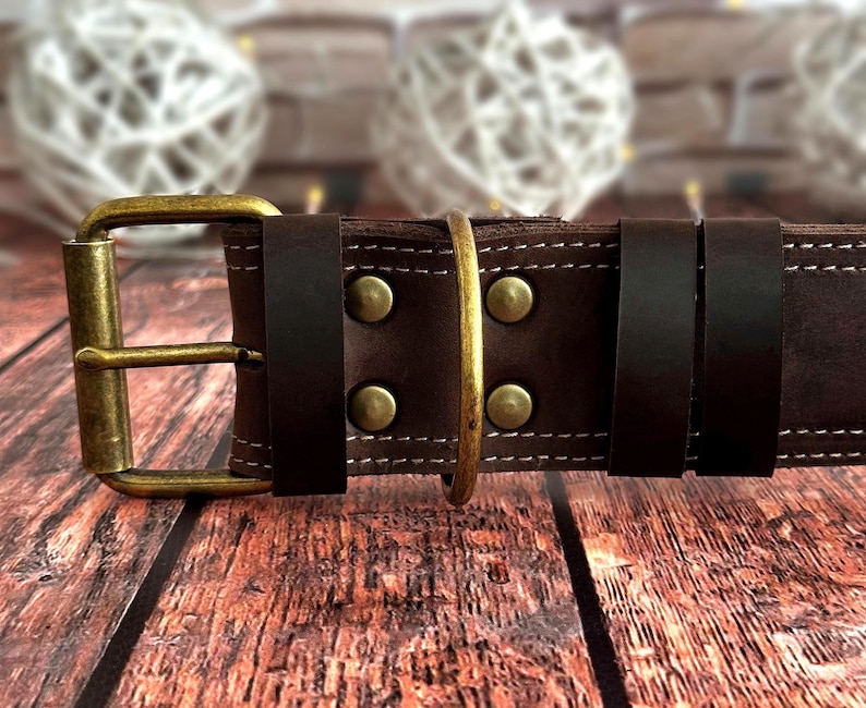 Handcrafted dark brown leather dog collar featuring double stitching, antique brass hardware, and a durable three-layer construction.