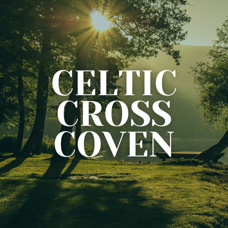 May include: A scenic image with a lake and trees in the background. The text "CELTIC CROSS COVEN" is written in white letters on a green grassy field.