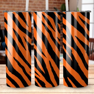 May include: Three stainless steel tumblers with a black and orange tiger stripe pattern.