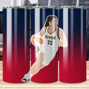 May include: A stainless steel tumbler with a red, white, and blue gradient design. The tumbler features a graphic of a basketball player in a white uniform with the text "FEVER 22" and a basketball. Includes a straw.