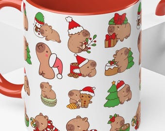 Può includere: Tazza in ceramica bianca con interno e manico rossi. La tazza presenta un motivo ripetuto di capibara dei cartoni animati in abiti natalizi festosi, inclusi cappelli di Babbo Natale e che tengono regali. Dimensione standard.