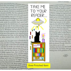 May include: Bookmark with the text "TAKE ME TO YOUR READER..." featuring a pixelated UFO, a black cat, a bookshelf with colorful books, and a fish icon. The bookmark is set against a backdrop of printed text.