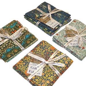 May include: Four bundles of patterned fabric, each tied with a white ribbon. The fabrics display floral and bird designs in shades of green, blue, and yellow. Ribbons are printed with "Crafty Fabrics" and "Morris by Crafty Fabrics".