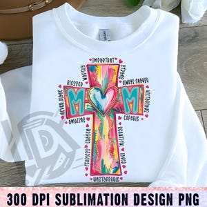 May include: A sublimation design featuring a colorful cross with the word "MOM" in the center. The cross is surrounded by words describing a mother, such as "worthy", "blessed", "strong", "capable", "fearless", "unstoppable", and "always enough".