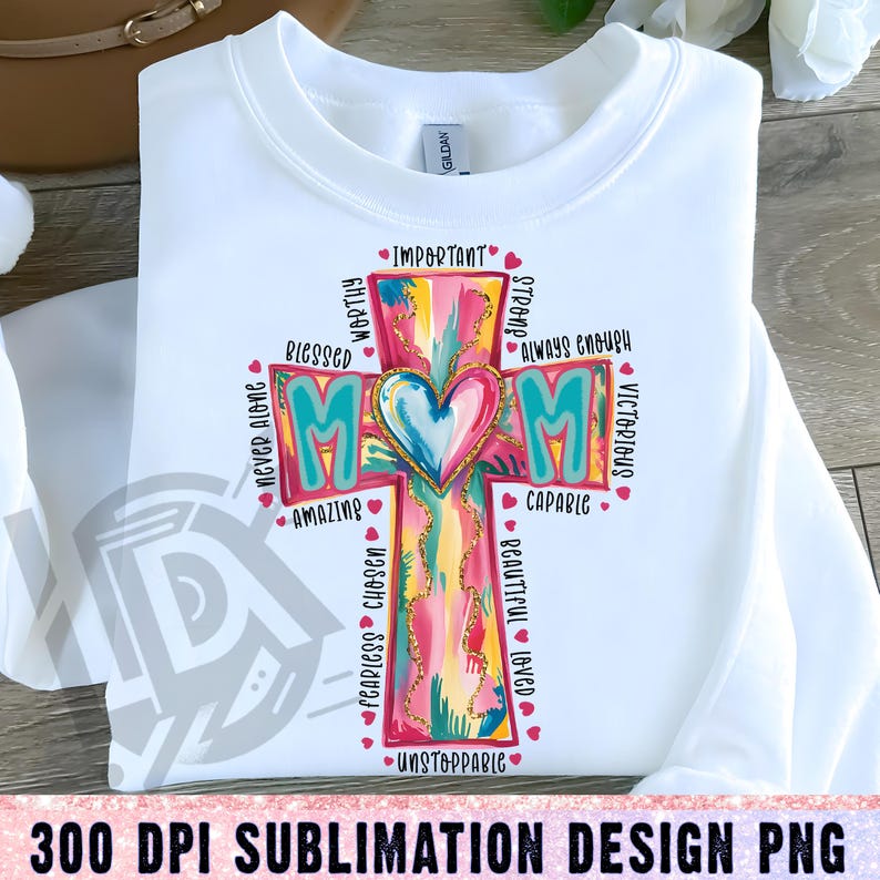 May include: A sublimation design featuring a colorful cross with the word "MOM" in the center. The cross is surrounded by words describing a mother, such as "worthy", "blessed", "strong", "capable", "fearless", "unstoppable", and "always enough".