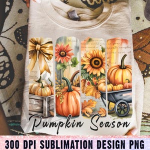 May include: A beige sweatshirt featuring a colorful fall-themed design. The design includes pumpkins, sunflowers, and autumn leaves, with the words "Pumpkin Season" in a script font. The bottom of the image reads "300 DPI SUBLIMATION DESIGN PNG".