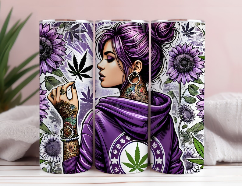 May include: A purple and green stainless steel tumbler with a graphic of a woman with purple hair and tattoos holding a marijuana leaf. The tumbler has a design of sunflowers and marijuana leaves.
