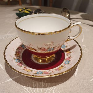 Tuscan fine English bone china. Hand painted floral design tea cup and saucer.