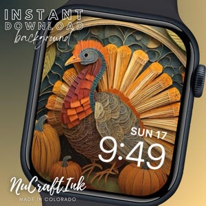 May include: A digital watch face with a Thanksgiving theme. The background features a paper-crafted turkey with pumpkins. The time is 9:49 and the day is Sunday, 17th. The text "NuCraftInk MADE IN COLORADO" is at the bottom of the watch face.