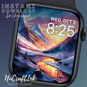 Op de afbeelding: Een digitaal horloge-scherm met een aquarel van een bergketen en een rivier die de zonsondergang reflecteert. De tijd is 8:25 en de datum is wo, 2 okt. De tekst "NuCraft Ink" en "MADE IN COLORADO" staat onderaan het horloge-scherm.