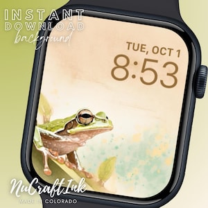 Puede incluir: Una esfera de reloj digital con una rana verde sobre un fondo de acuarela. La hora es 8:53 y la fecha es mar, 1 de oct. La esfera del reloj está etiquetada como "NuCraft Ink, Made in Colorado".
