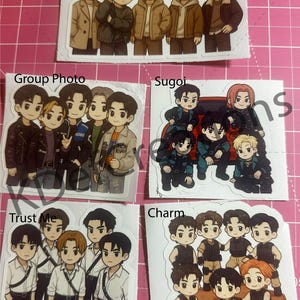 May include: A collection of sticker sheets featuring cartoon illustrations of a group of young men in various poses and outfits. Each sticker sheet has a different title, including "Umm Umm", "Group Photo", "Sugoi", "Trust Me", and "Charm".