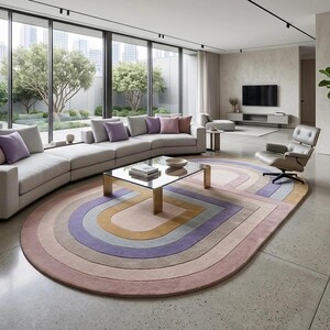Bright living room under curved sofa, modern oval area rug in dusty rose and purple, abstract geometric rug