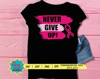 May include: Black t-shirt with a pink and white brush stroke design that says "NEVER GIVE UP!" and a pink ribbon with black hearts. The design is a reminder to stay strong and never give up.